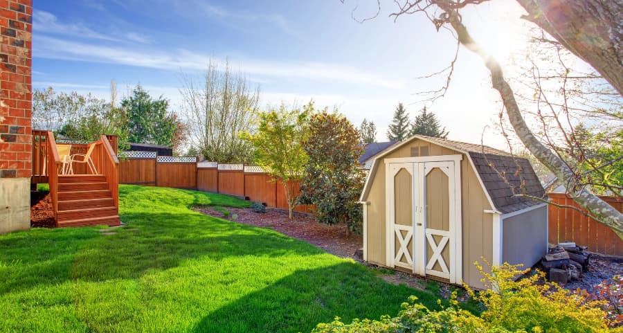 Fenced backyard with storage shed in Eau Claire